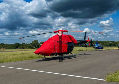 Bell 429 in the sun fitted with red Air Covers operational cover set.
