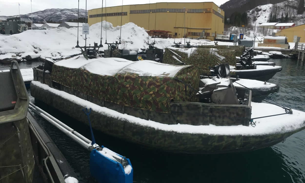 Orc Military Boat- Protective Covers - in Snow Orc military boat with protective cover in snow, icy conditions.